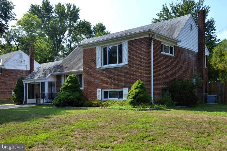 6911 Gilbert Street Springfield, VA 22150 - Photo 25 of 30 a front view of a house with garden