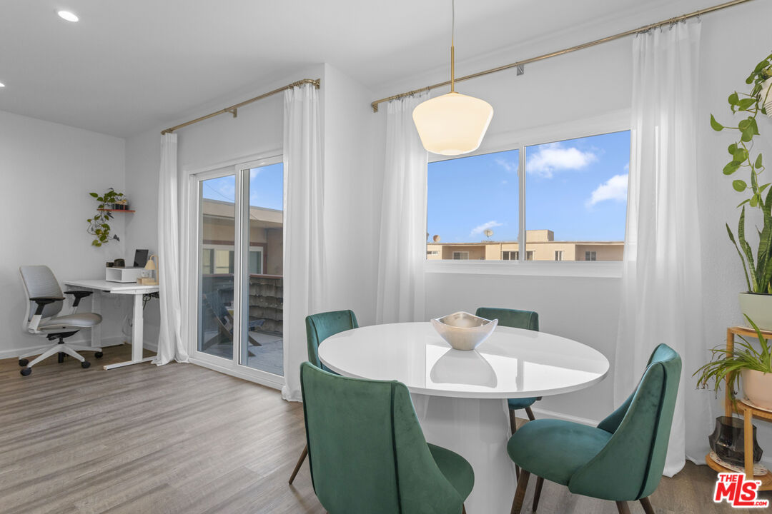 5414 Newcastle Avenue, Unit 50 Encino, CA 91316 - Photo 8 of 23 a view of a dining room with furniture and wooden floor