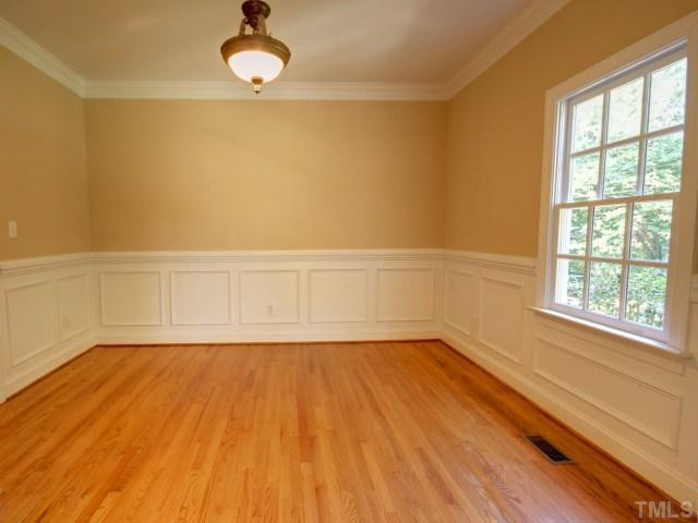 206 Avon Drive Raleigh, NC 27608 - Photo 3 of 12 Formal Living Room with Handsome Wainscoting and Hardwood Floors. Living Room