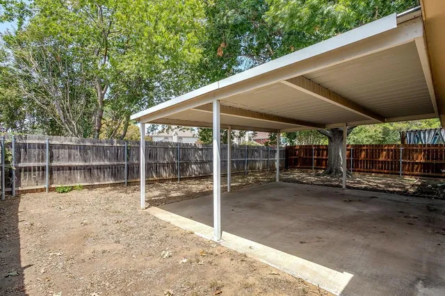 a picture of a bench in front of a building