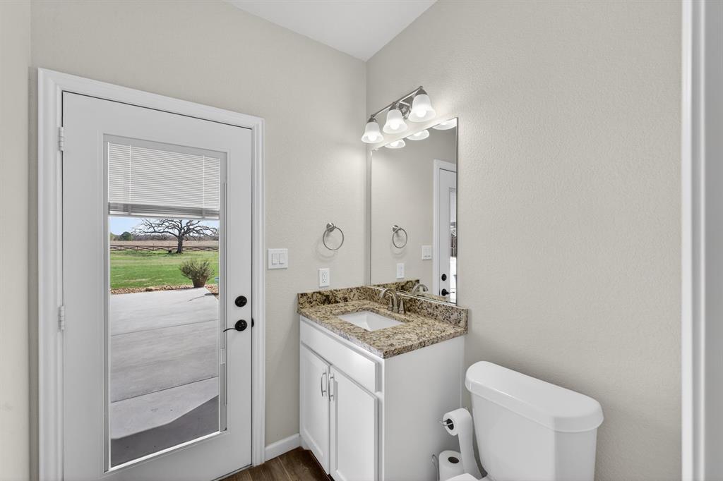 7613 Carter Ranch Road Azle, TX 76020 - Photo 20 of 37 Half bath leading to pool area!
