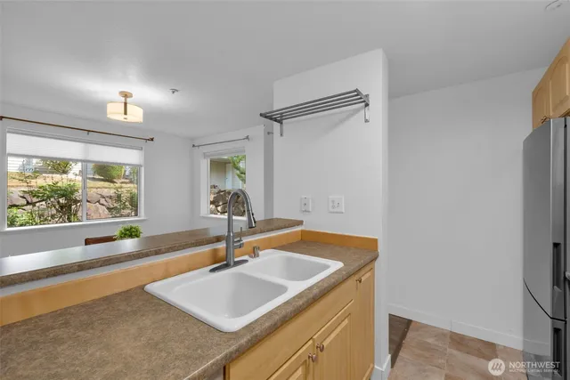 a bathroom with a sink and a large mirror