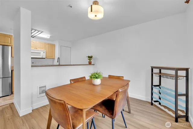 a view of a dining room with furniture and wooden floor