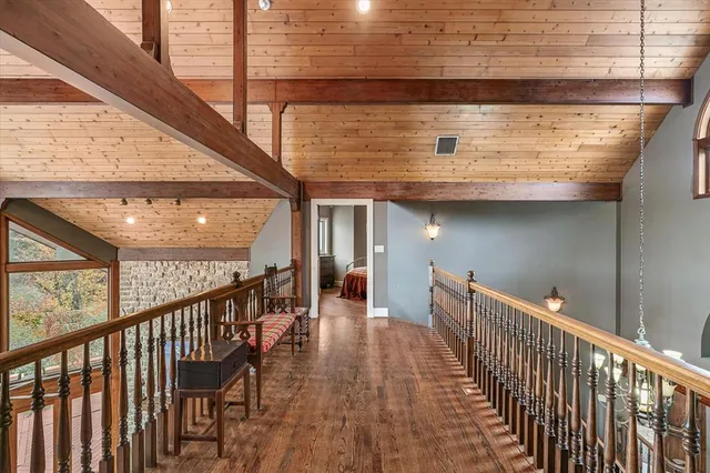 a view of a balcony with couches and wooden floor