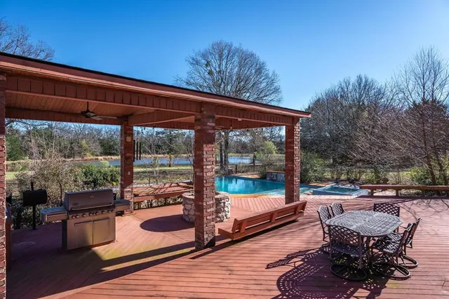 a balcony with furniture and garden view