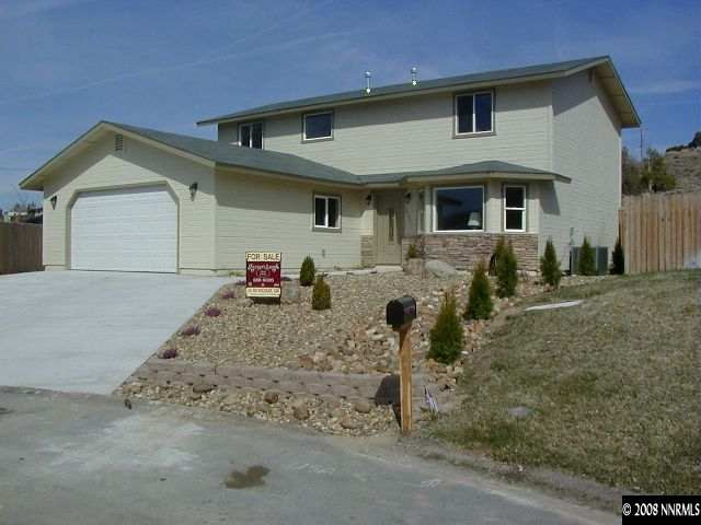 16035 Tourmaline Drive Reno, NV 89521 - Photo 1 of 9 a front view of a house with garden