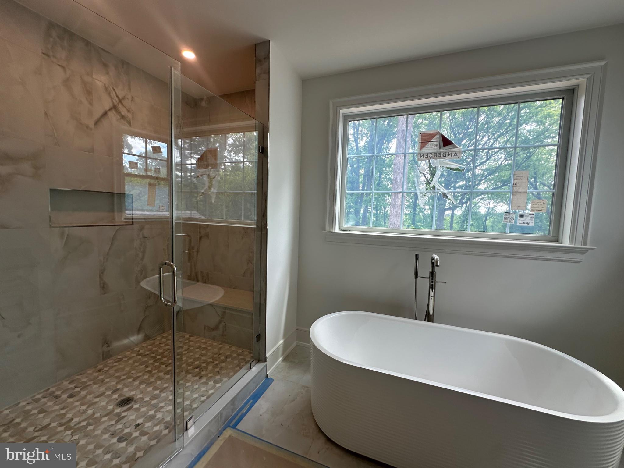 353 Oak Terrace Wayne, PA 19087 - Photo 4 of 13 a bathroom with a bathtub and shower