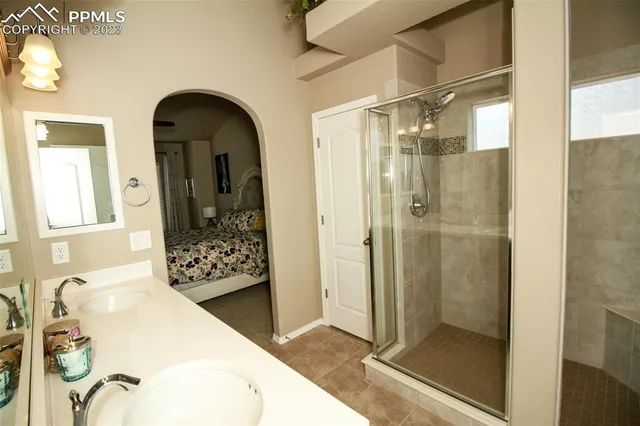 a bathroom with a tub and shower