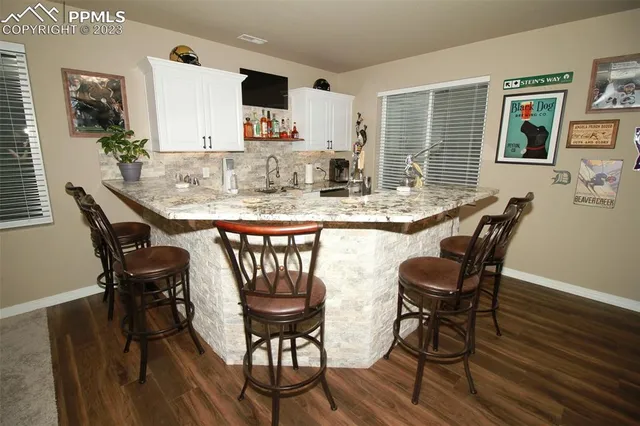 a dining room with furniture and window