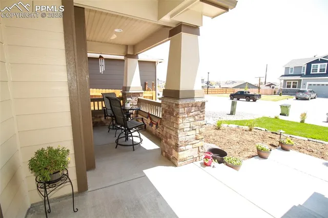 a view of a terrace with furniture and garden view