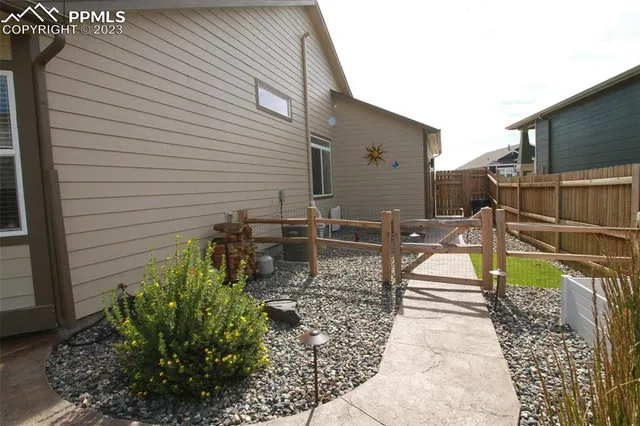 a view of a chairs and table in patio