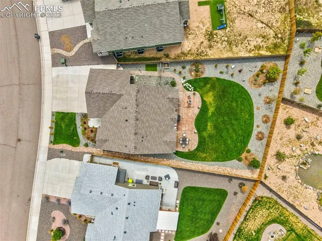 an aerial view of a house with a swimming pool