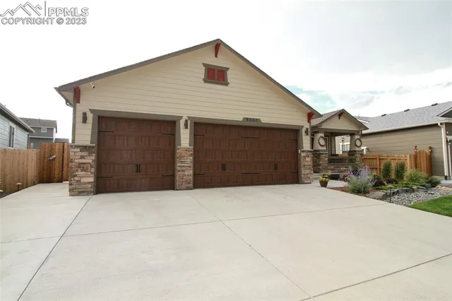 a front view of house with garage