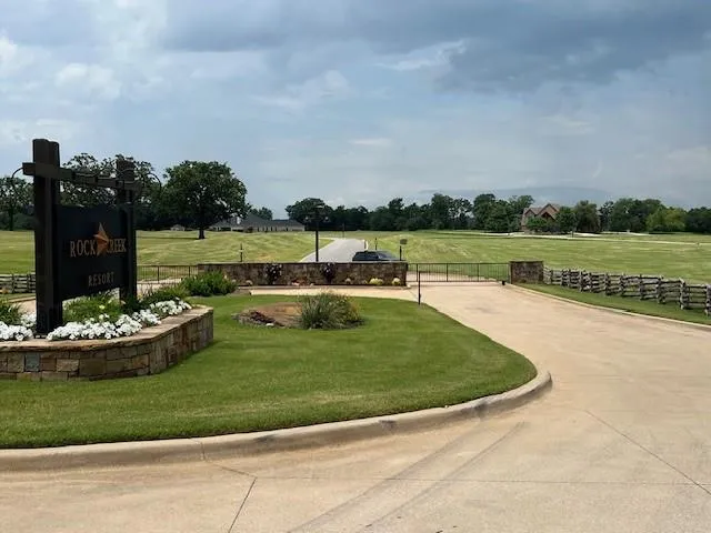 a view of a lake with a yard