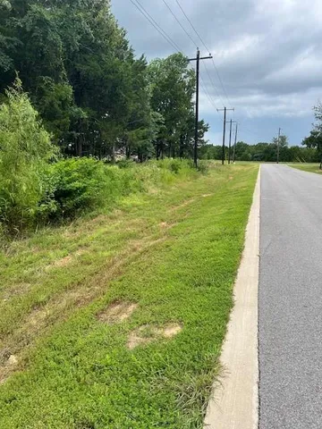 a view of a golf course with a lake