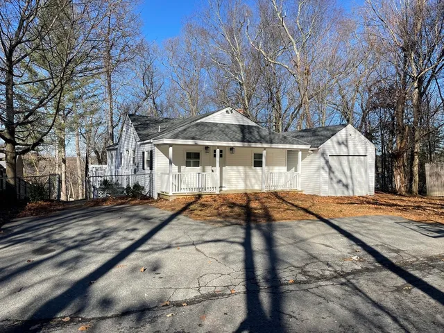 a house with trees in front of it