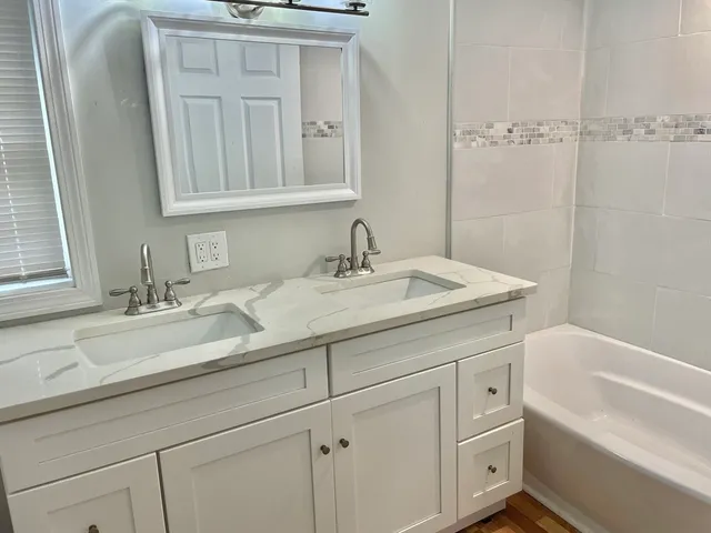 a bathroom with a sink and a bathtub