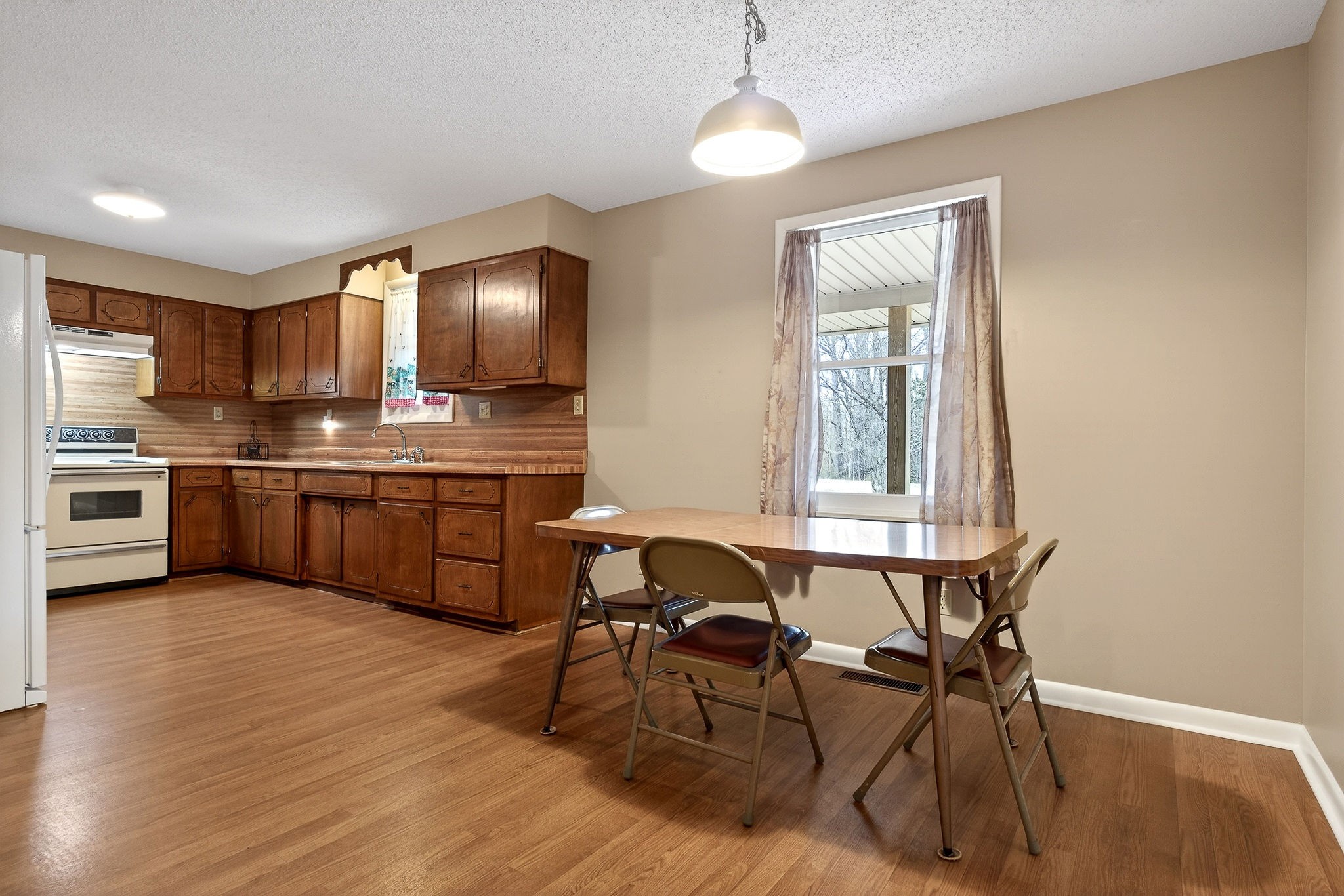 131 Poplar Springs Road Cookeville, TN 38506 - Photo 12 of 50 a view of a dining room with furniture and wooden floor