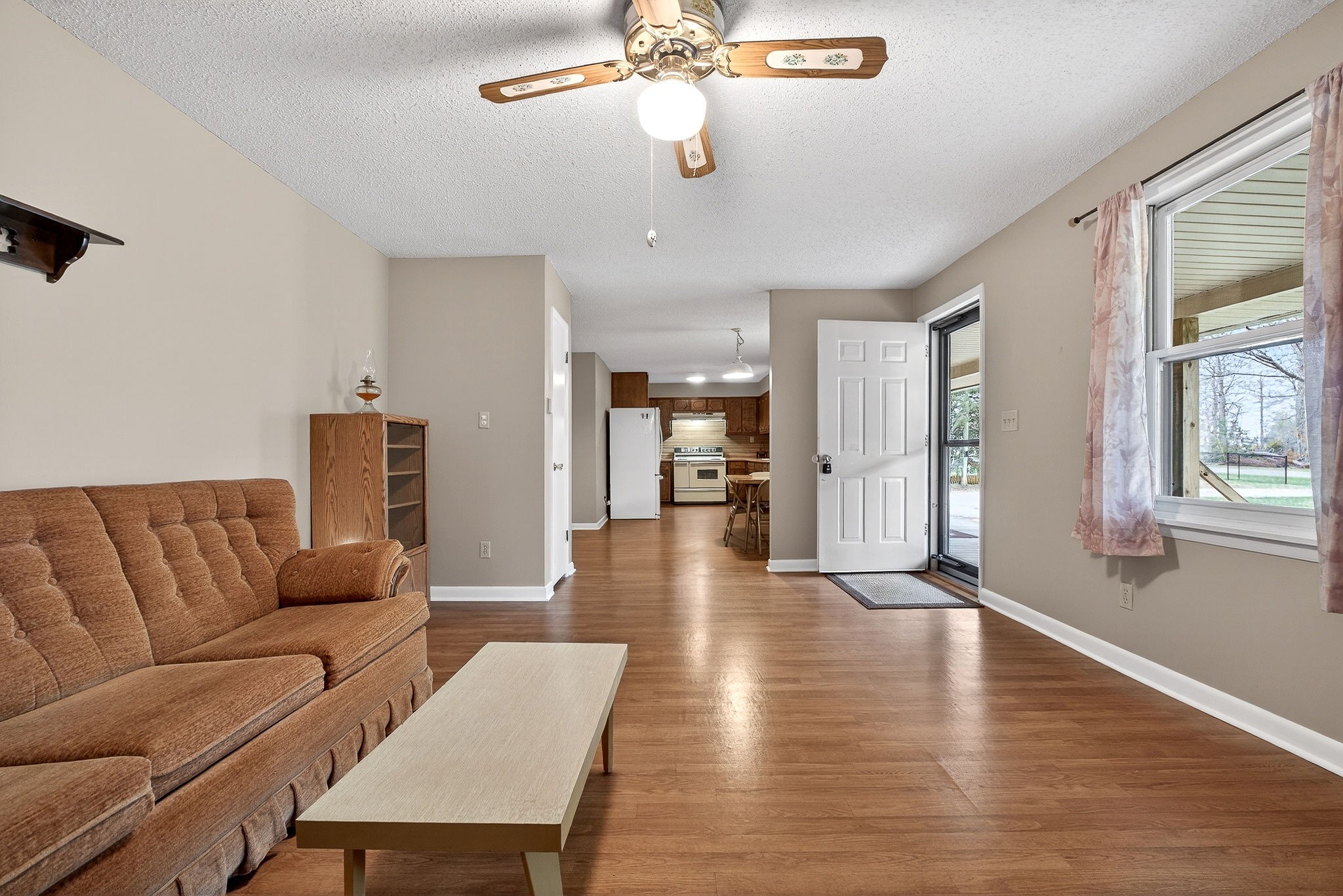 131 Poplar Springs Road Cookeville, TN 38506 - Photo 14 of 50 a living room with furniture and a chandelier