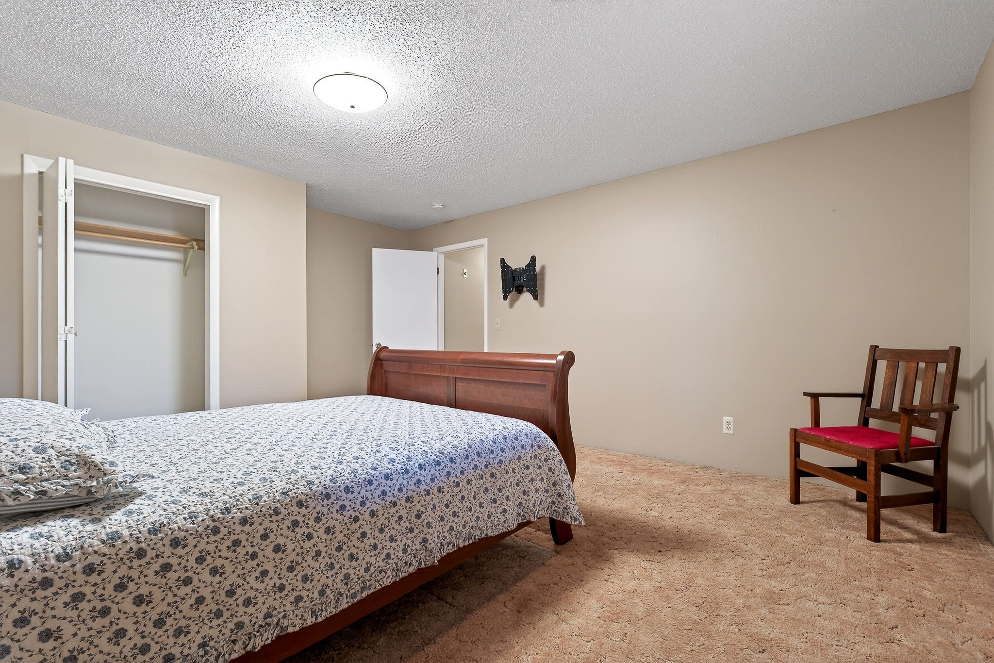 131 Poplar Springs Road Cookeville, TN 38506 - Photo 17 of 50 a bedroom with a bed and chair