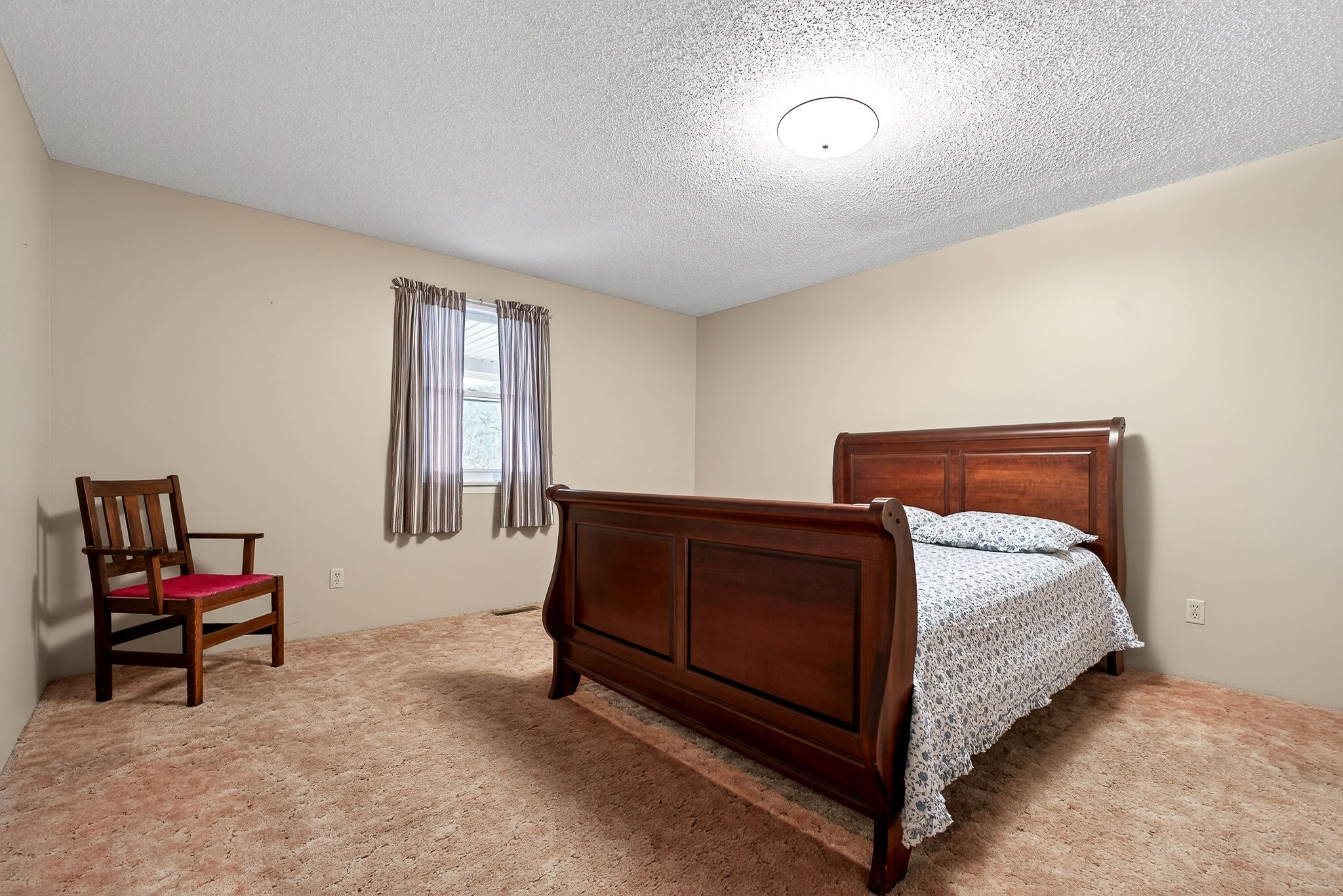 131 Poplar Springs Road Cookeville, TN 38506 - Photo 18 of 50 a bedroom with a bed and a chair