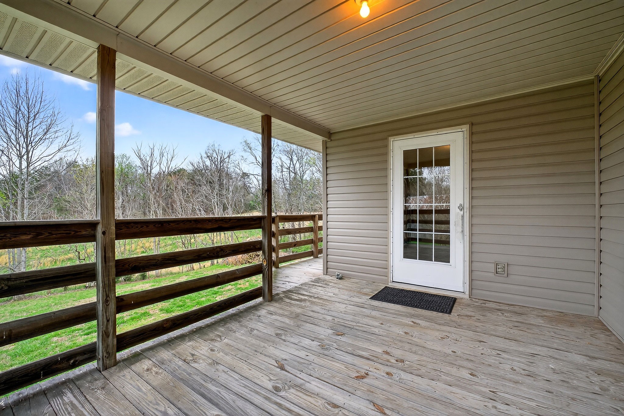 131 Poplar Springs Road Cookeville, TN 38506 - Photo 31 of 50 an empty room with wooden floor and walls