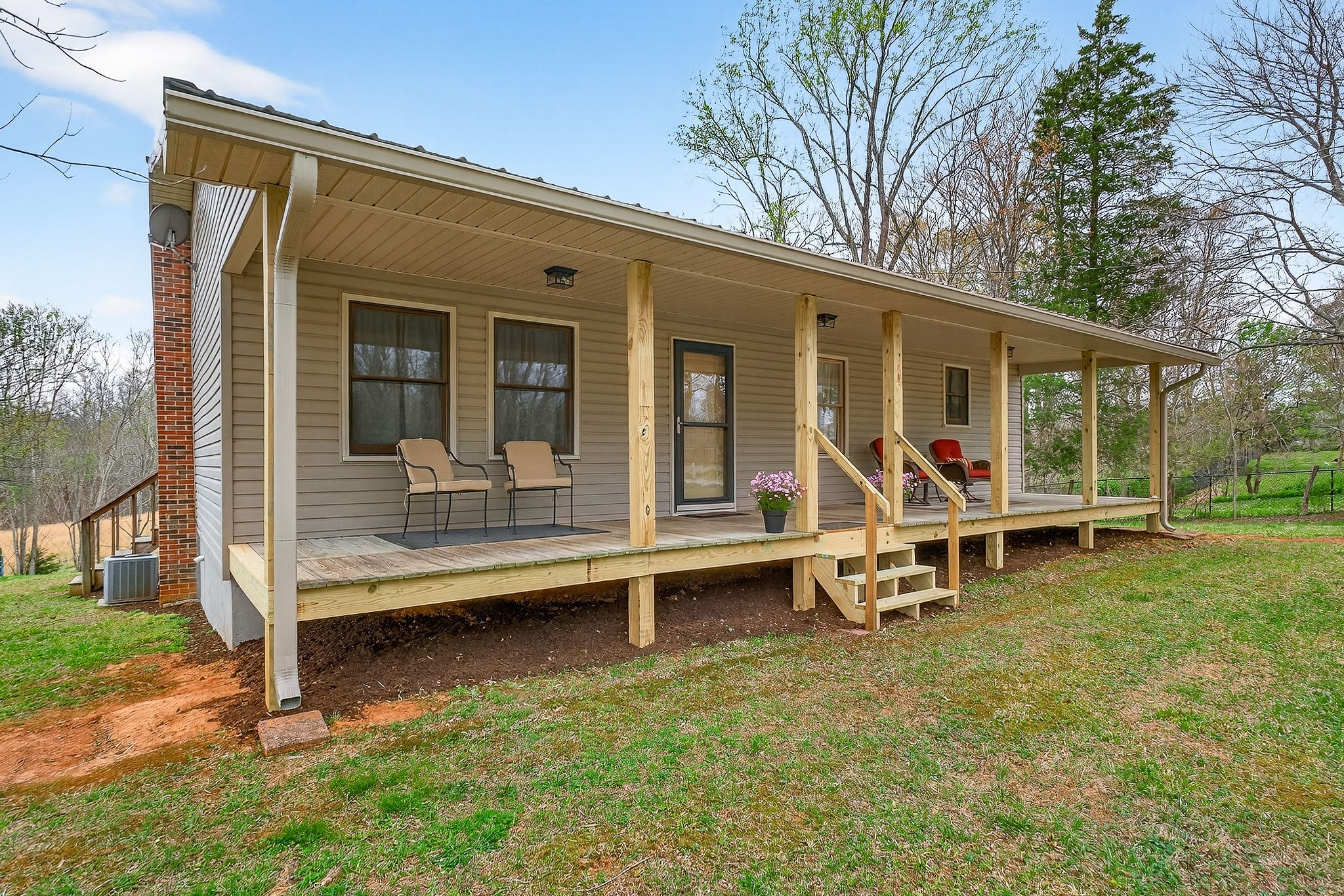 131 Poplar Springs Road Cookeville, TN 38506 - Photo 39 of 50 a view of a house with a backyard porch and sitting area