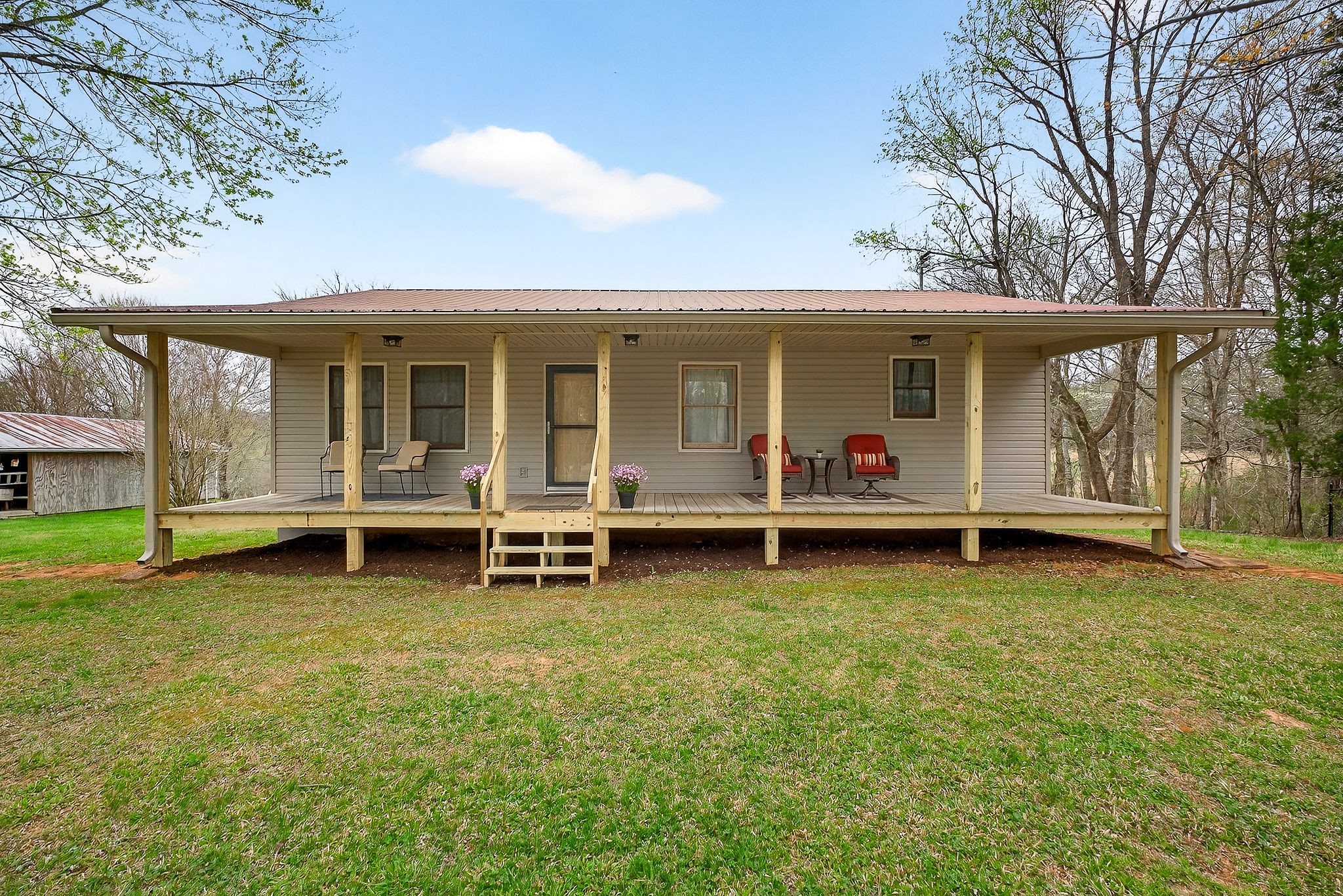 131 Poplar Springs Road Cookeville, TN 38506 - Photo 4 of 50 a view of a house with a yard and a large tree