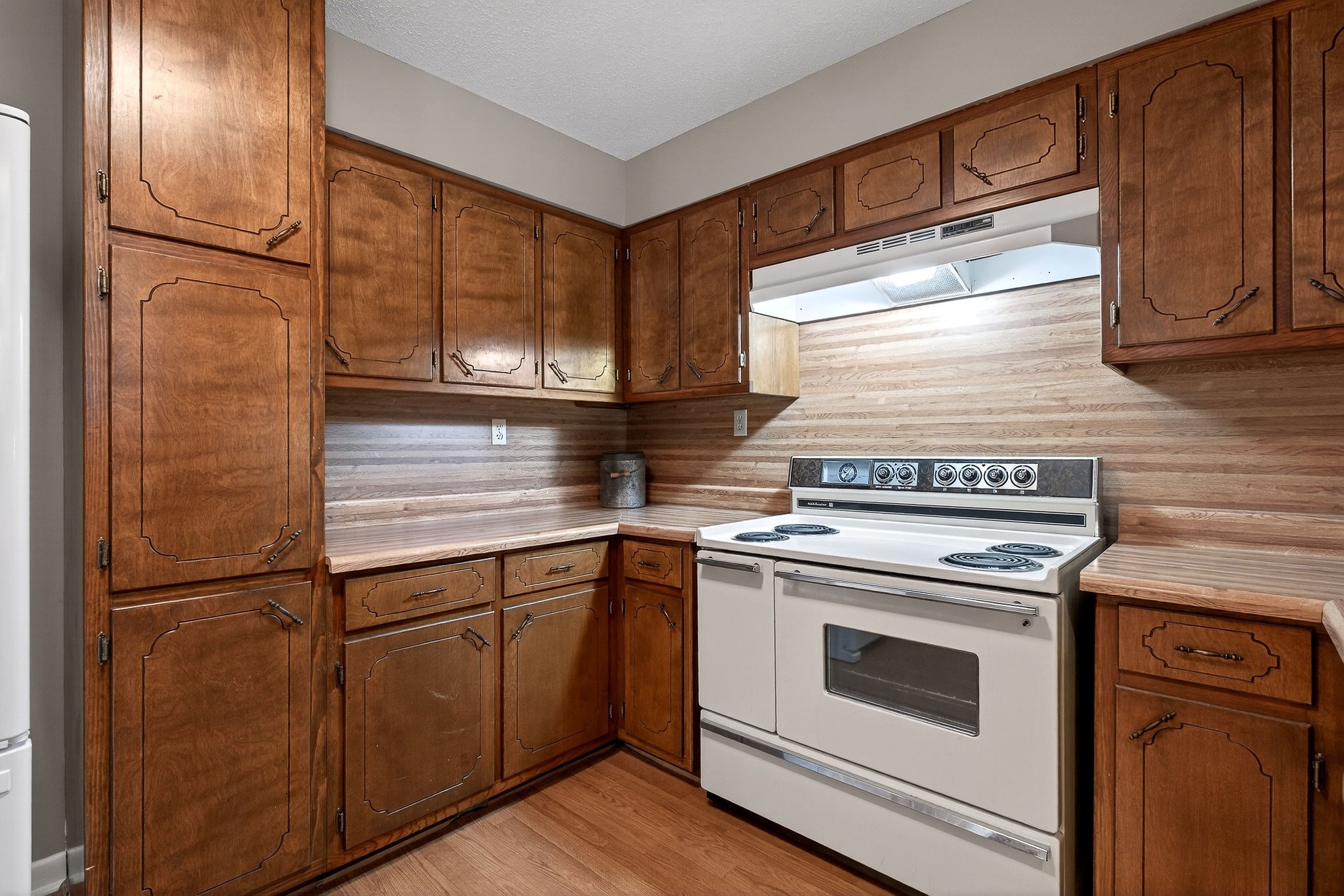 131 Poplar Springs Road Cookeville, TN 38506 - Photo 8 of 50 a kitchen with granite countertop stainless steel appliances and wooden cabinets