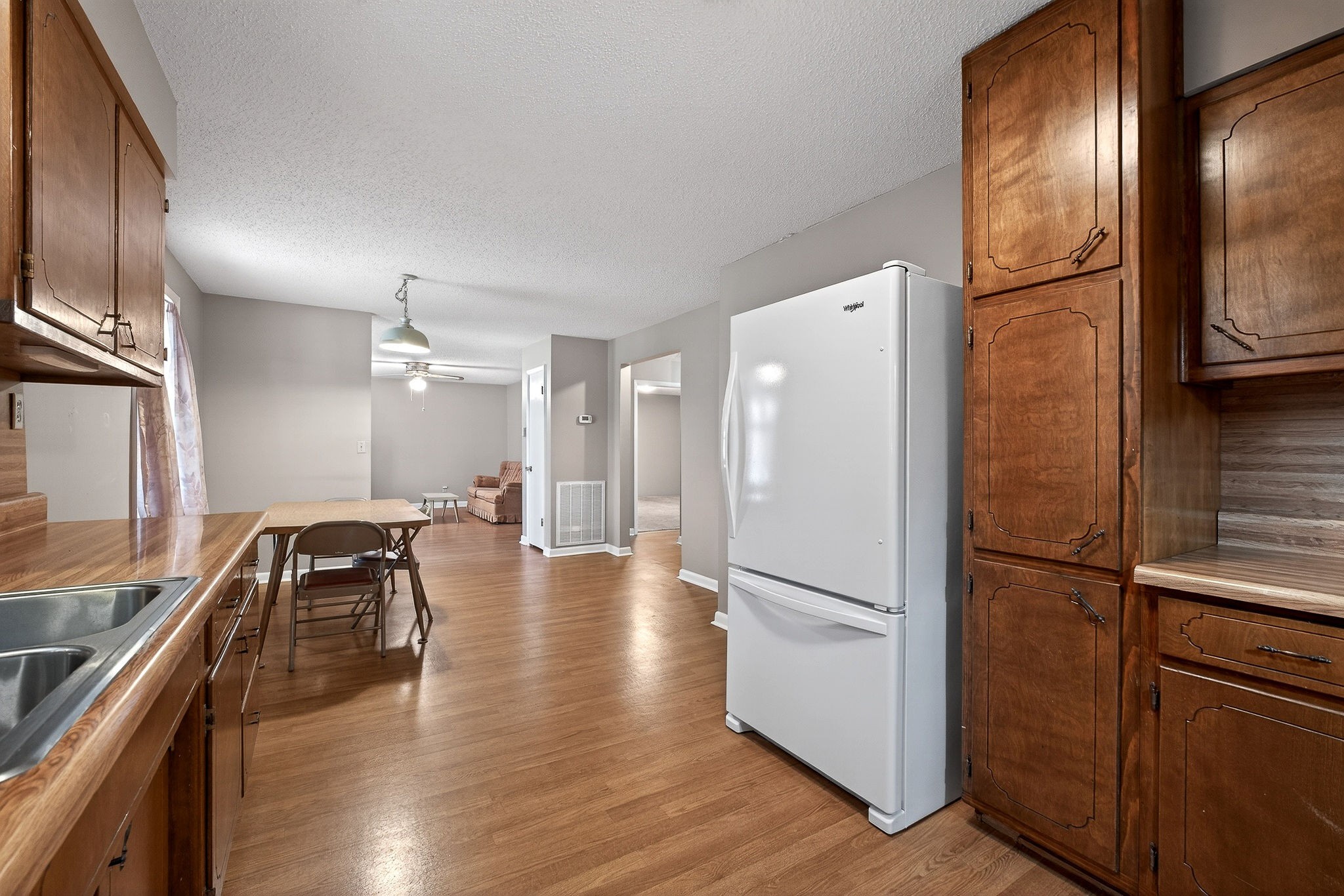 131 Poplar Springs Road Cookeville, TN 38506 - Photo 10 of 50 a view of a refrigerator in kitchen and wooden floor