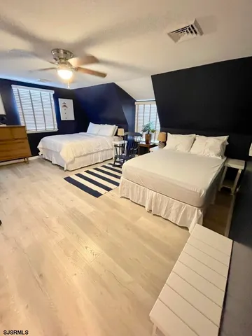 a bedroom with double bed and a night stand