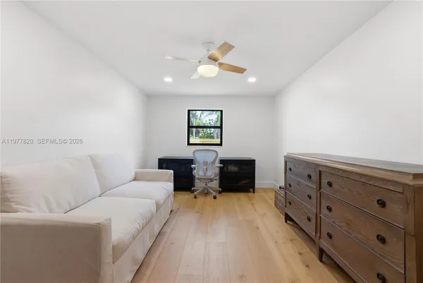 a living room with furniture and a window