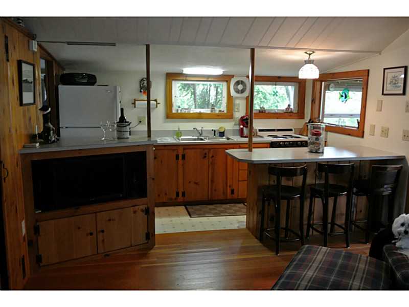 108 Sanctuary Road Charlestown, RI 02813 - Photo 11 of 23 Kitchen. Kitchen with eating bar. TV has FREE HD channels due to an antenna. Windows are insulated glass. Well water has purification system. Extra refrigerator in the shed for overflow items like watermelons!