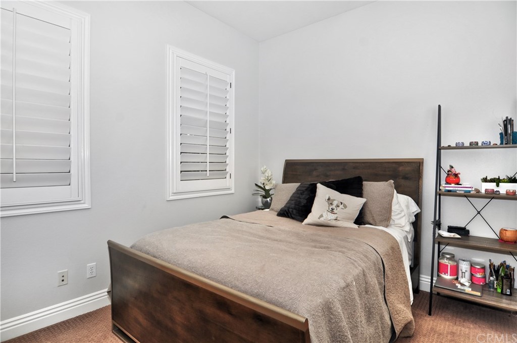 21 Catania Newport Coast, CA 92657 - Photo 14 of 31 a bedroom with a bed and a window