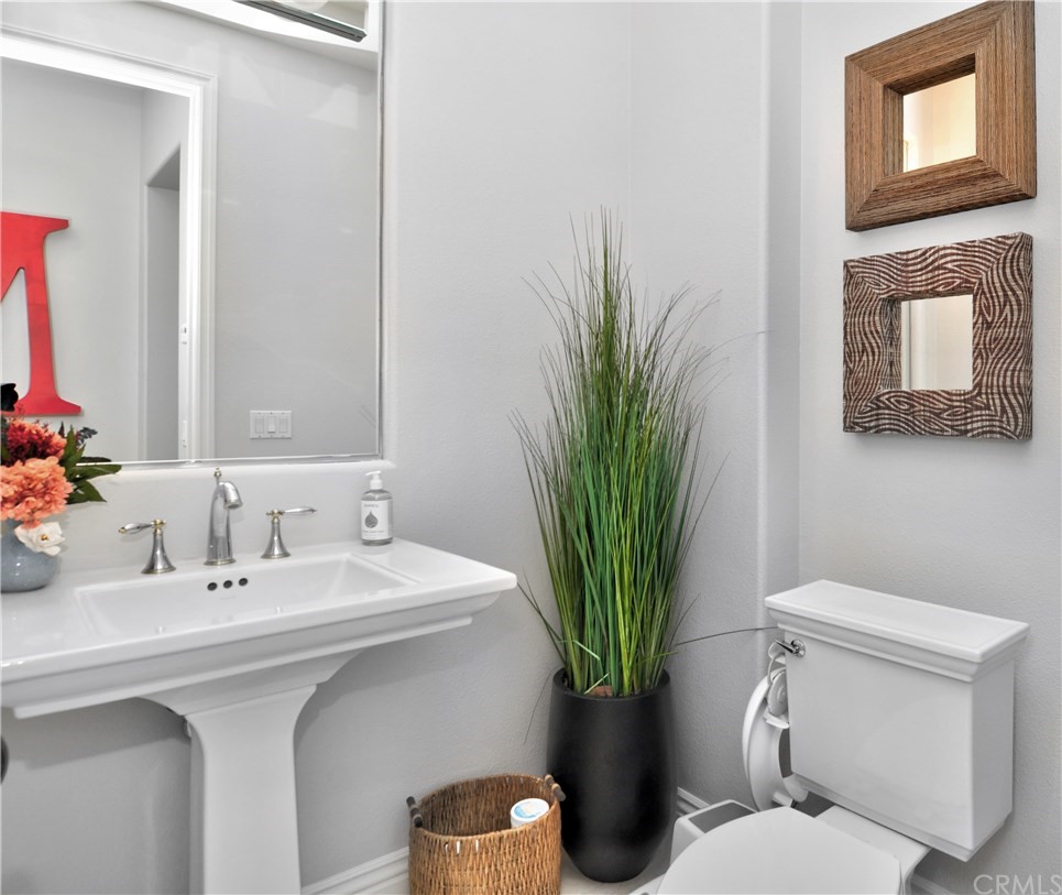 21 Catania Newport Coast, CA 92657 - Photo 15 of 31 a bathroom with a toilet a sink and mirror