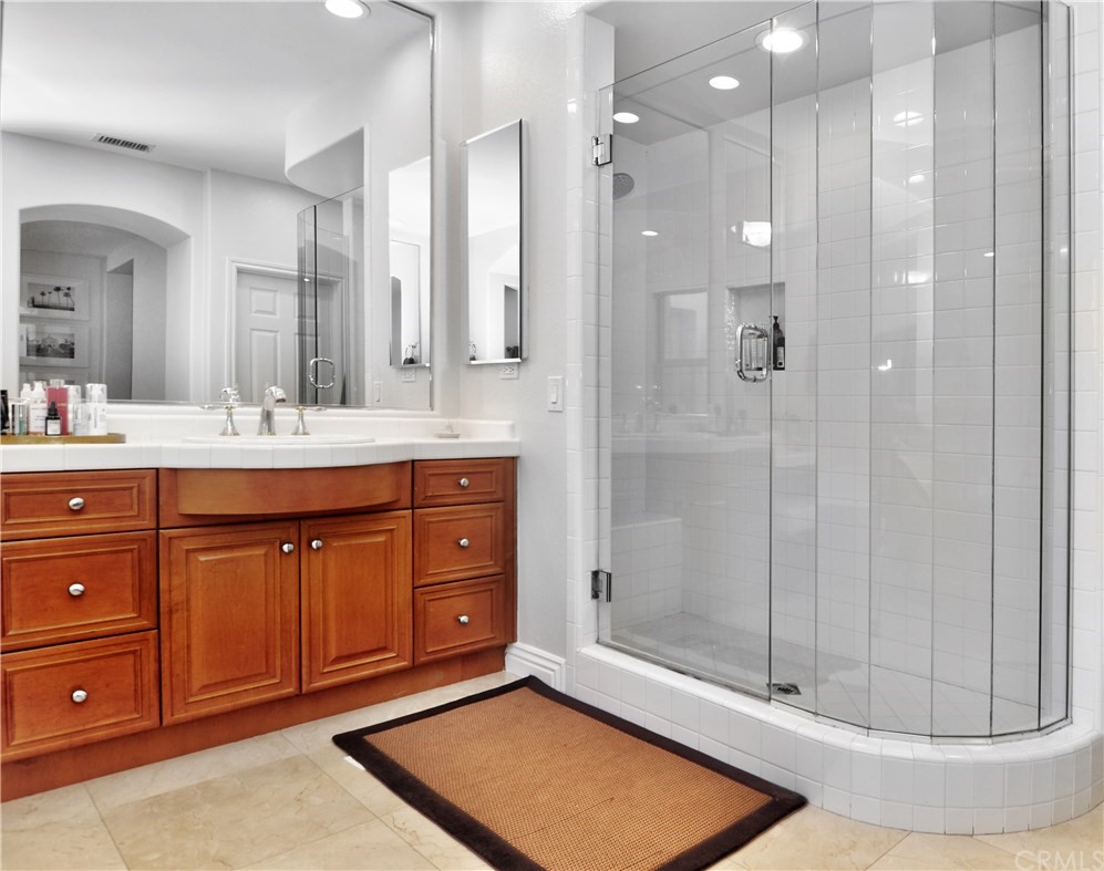 21 Catania Newport Coast, CA 92657 - Photo 22 of 31 a bathroom with a sink double vanity and a shower