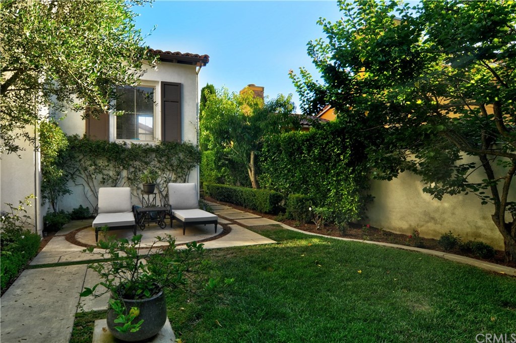 21 Catania Newport Coast, CA 92657 - Photo 30 of 31 a view of a house with backyard sitting area and garden