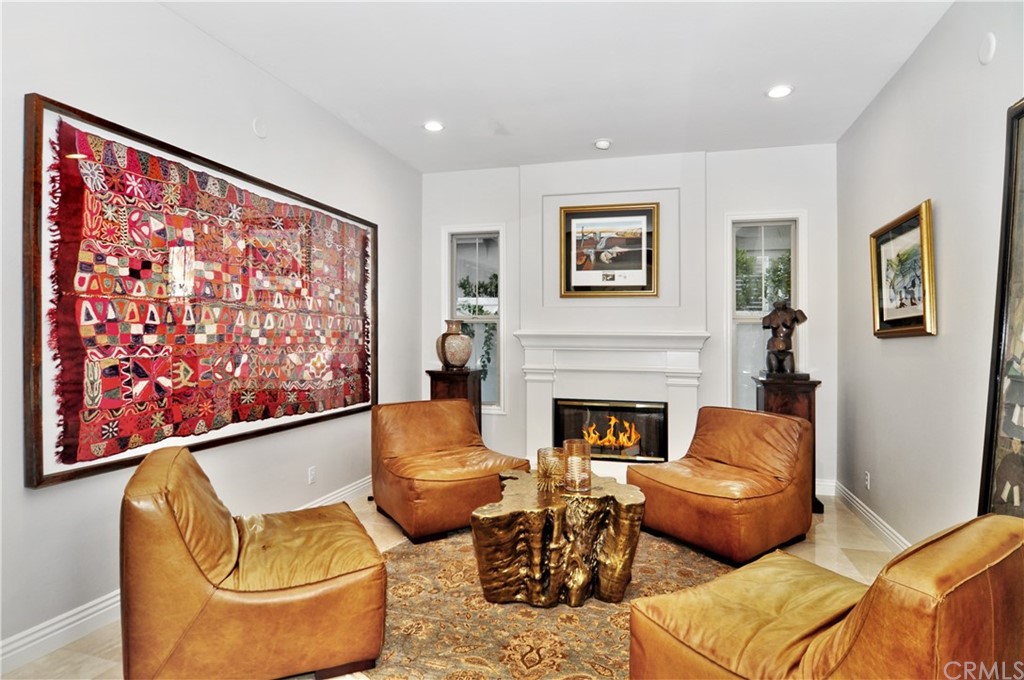 21 Catania Newport Coast, CA 92657 - Photo 6 of 31 a living room with furniture and a fireplace