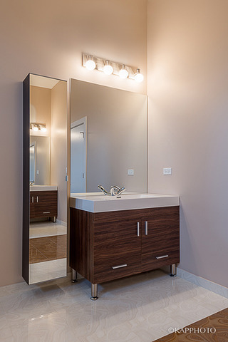 2835 West Division Street, Unit 3E Chicago, IL 60622 - Photo 20 of 25 a bathroom with a sink and a mirror