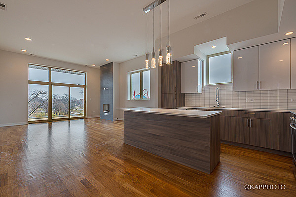 2835 West Division Street, Unit 3E Chicago, IL 60622 - Photo 5 of 25 a spacious bathroom with a granite countertop sink and a large mirror