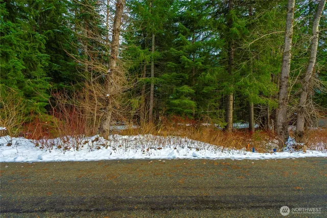 a view of water with a building in the background