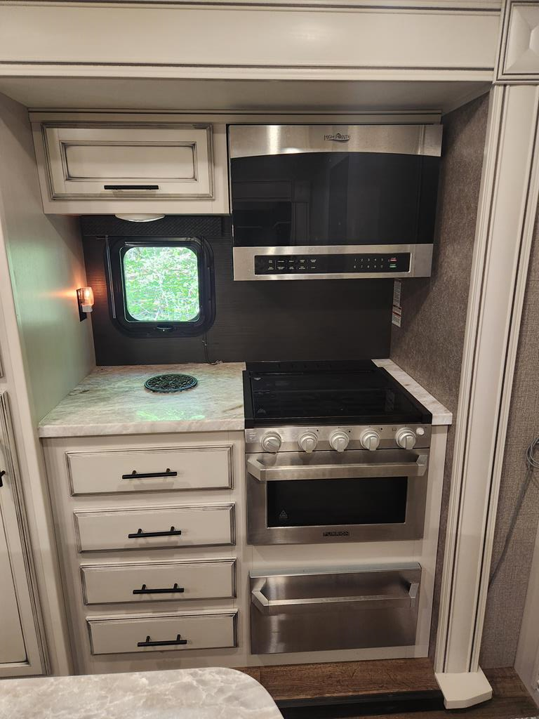 257 20th Street Ellijay, GA 30540 - Photo 12 of 29 a stove top oven sitting inside of a kitchen