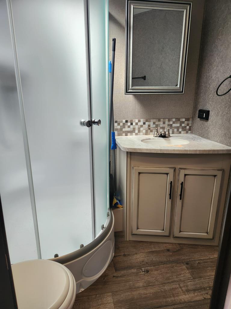 257 20th Street Ellijay, GA 30540 - Photo 17 of 29 a bathroom with a granite countertop sink toilet and mirror