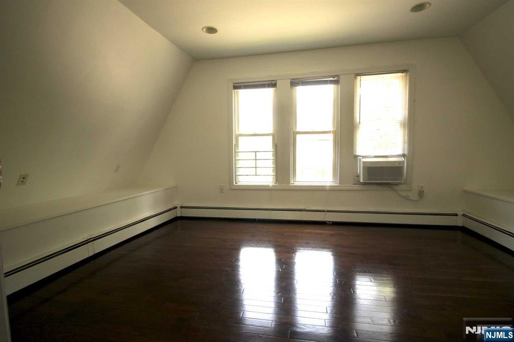 6 Cottage Place Allendale, NJ 07401 - Photo 12 of 20 an empty room with wooden floor and windows