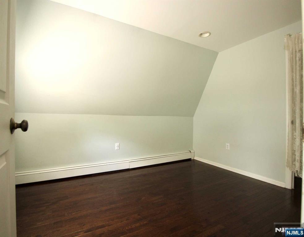 6 Cottage Place Allendale, NJ 07401 - Photo 13 of 20 an empty room with a wooden floor and white wall
