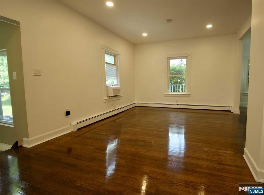 6 Cottage Place Allendale, NJ 07401 - Photo 7 of 20 a view of empty room with wooden floor and fan
