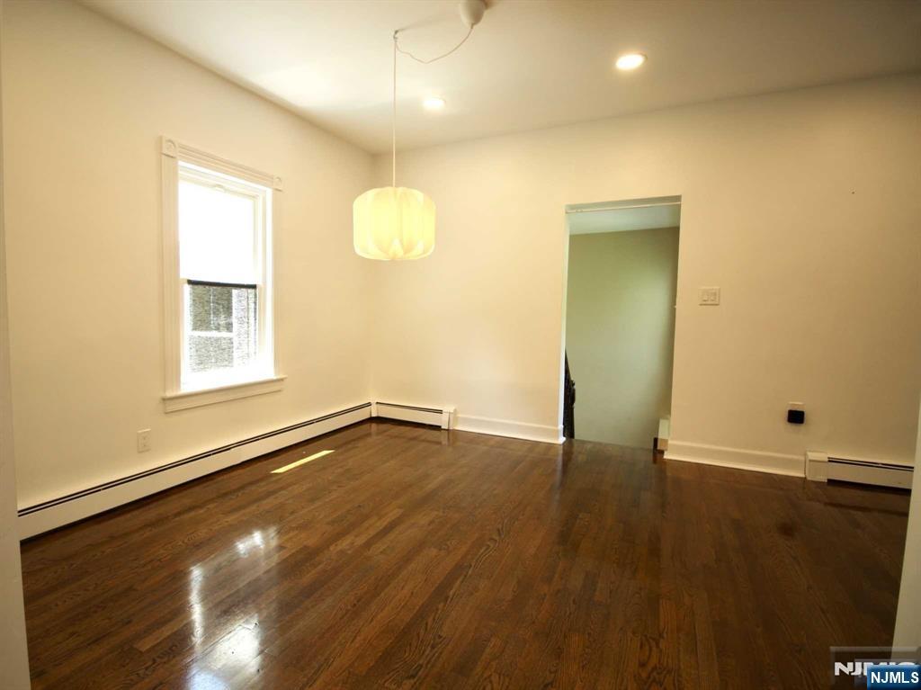 6 Cottage Place Allendale, NJ 07401 - Photo 8 of 20 an empty room with wooden floor and windows