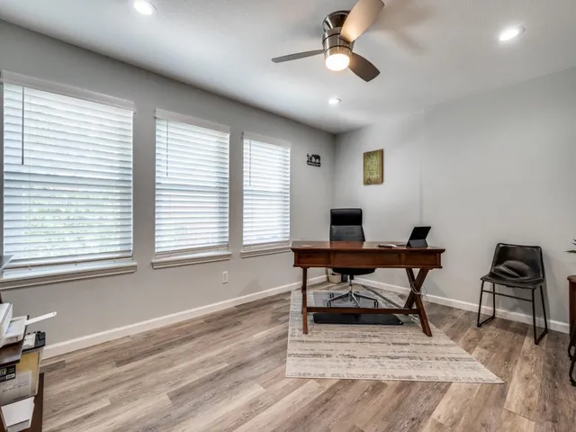 a room with furniture pool table and flat screen tv