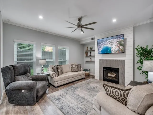 a living room with furniture and a fireplace