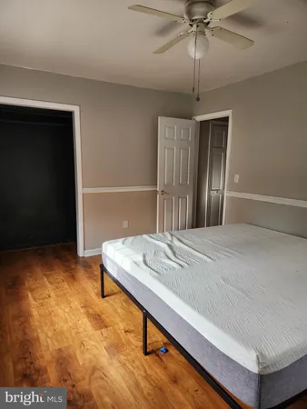 a room with pool table and windows